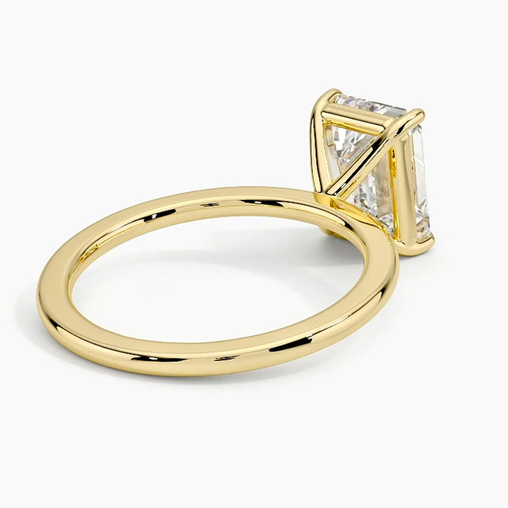 Classic Four-Prong Emerald Solitaire Ring