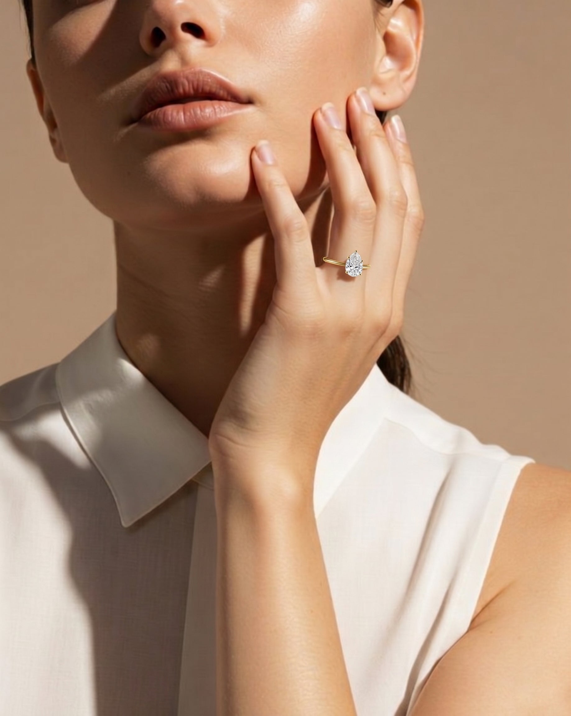 Hidden Halo Pear Solitaire Ring